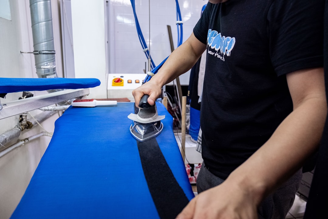 team-02 a-man-is-using-a-sanding-machine-on-a-blue-surface-f3vwnvie8lg