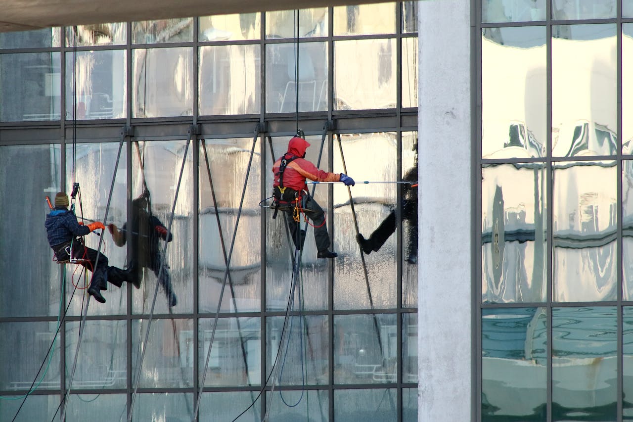 services-01 Professional window cleaners working on a skyscrapers exterior in Saint Petersburg, Russia.